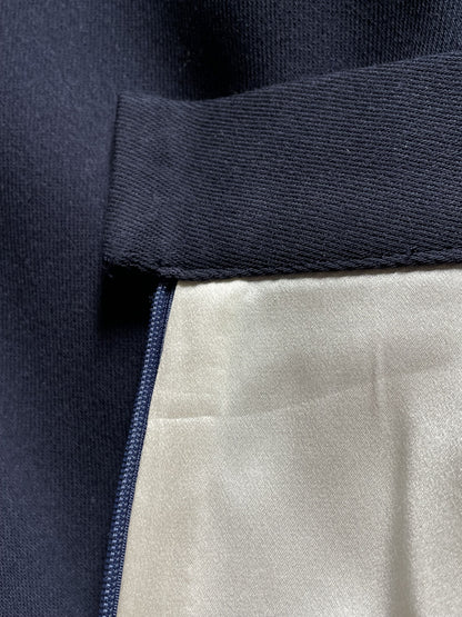 Close-up of midnight blue wool skirt interior silk lining