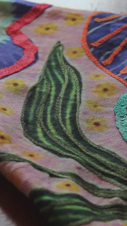 Close up texture of embroided silk cashmere scarf.